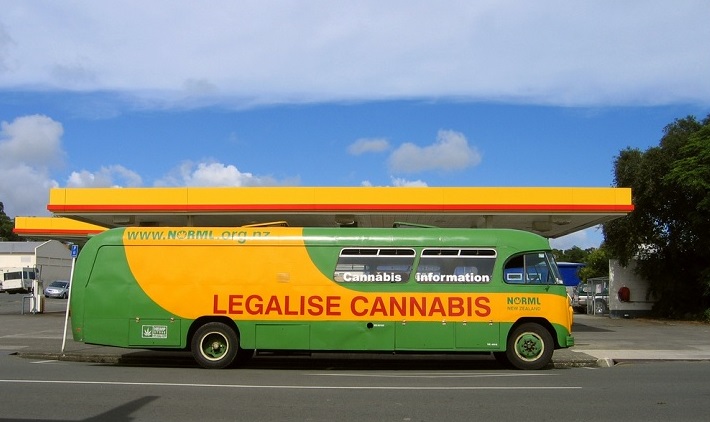 A bus with advertising stating "legalise cannabis"