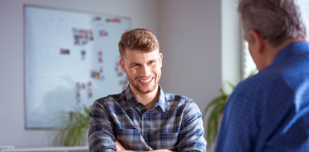 Man smiling in therapy session in drug and alcohol rehab Doncaster